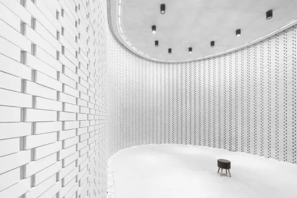 Interior Architectural Photography captures the solemn Void's central torch-like memorial.