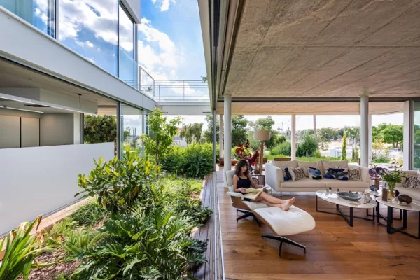 Interior of The Garden House in the City, showcasing surrounding green plants