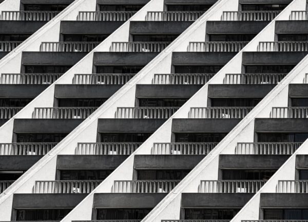 Black and white detail of repeating balcony railings at a Hyatt hotel.