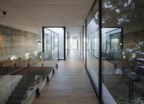 Interior view of Villa Grazalema (by Ignacio Merino Rivero) showing glass balustrades and staircases.