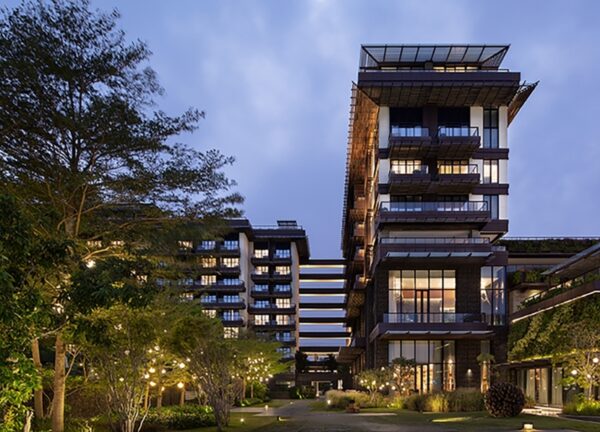 Close-up exterior shot of 1 Hotel Haitang Bay showcasing lava stone gabions and eco-timber screens.