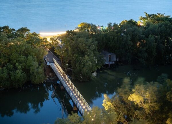 Curved walkway bridge at Bayphere Hotel Pattaya leading guests toward the beach
