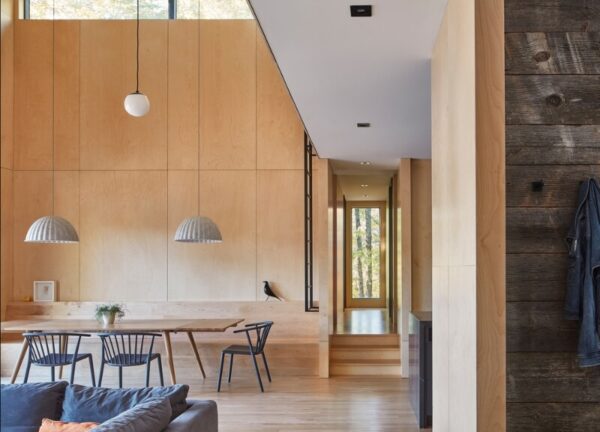Interior view of Catchacoma Cottage showing dining table within the open-plan living area.