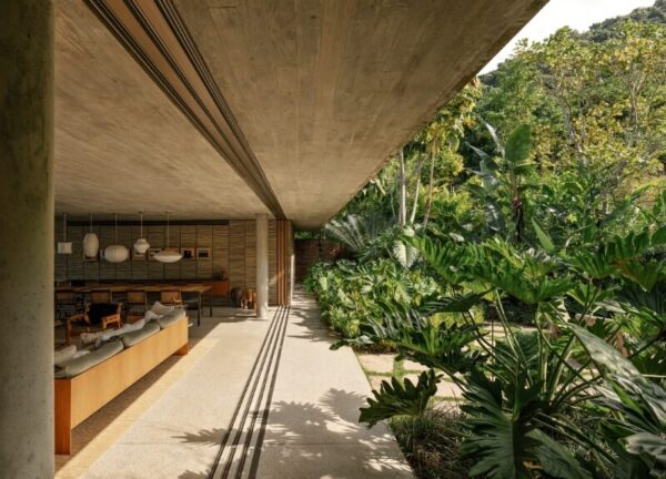 Living room of Patios House fully open to the surrounding nature with no walls or glass barriers.