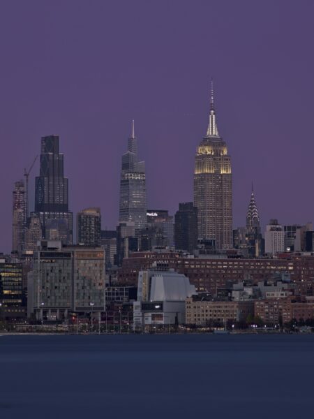 Manhattan buildings during blue hour with deep atmospheric hues