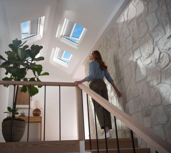 Skylight casting soft daylight and shadows into minimalist interior