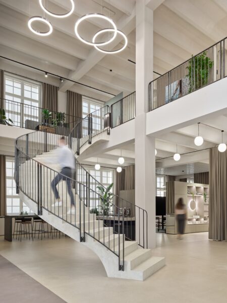Talsee Flagshipstore interior with open staircase and flowing floor design