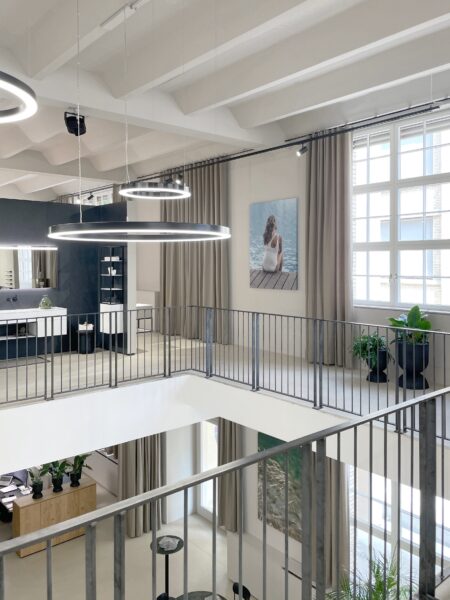 Talsee Flagshipstore interior with open staircase and flowing floor design