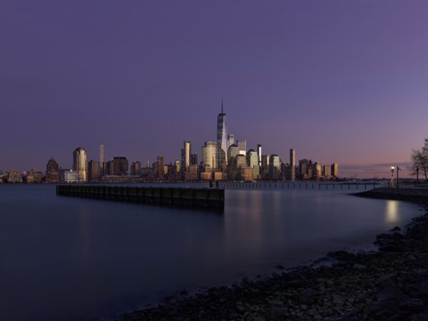 Manhattan buildings during blue hour with deep atmospheric hues