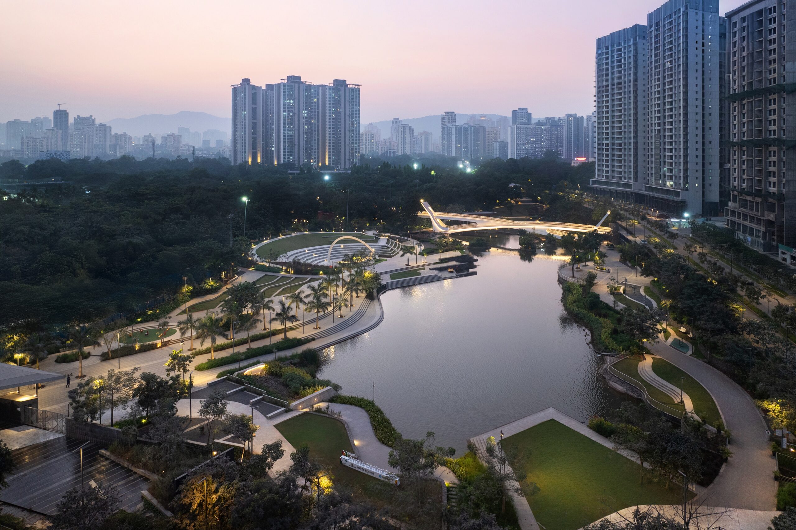 Illuminated landscape and water features at NaMo Grand Central Park